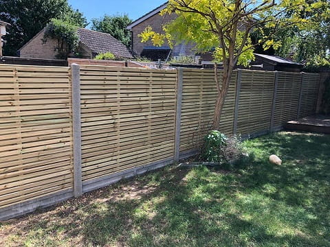 Modern fence panels with concrete posts and gravel boards.