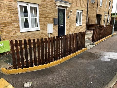 Wooden picket fence replacement.